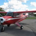 Flugplatz Bad Neustadt - Grasberg am 10.8.2024, Oldtimer Piper PA 22 neben der Tankstelle