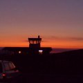 Clubheim und Turm im Sonnentuntergang